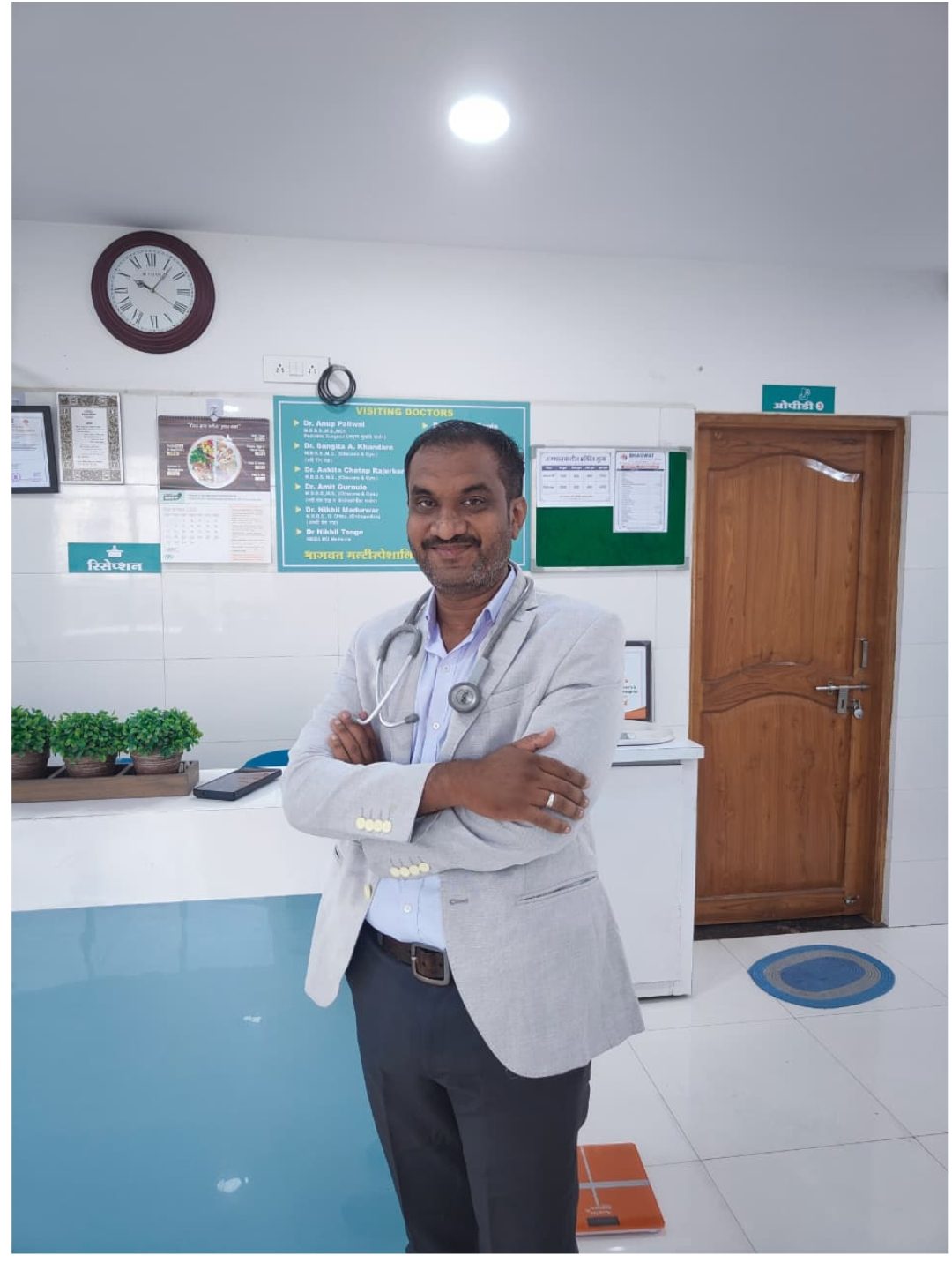 Dr. Tushar M. Bhagwat in the consultation room at Bhagwat Multispeciality Hospital